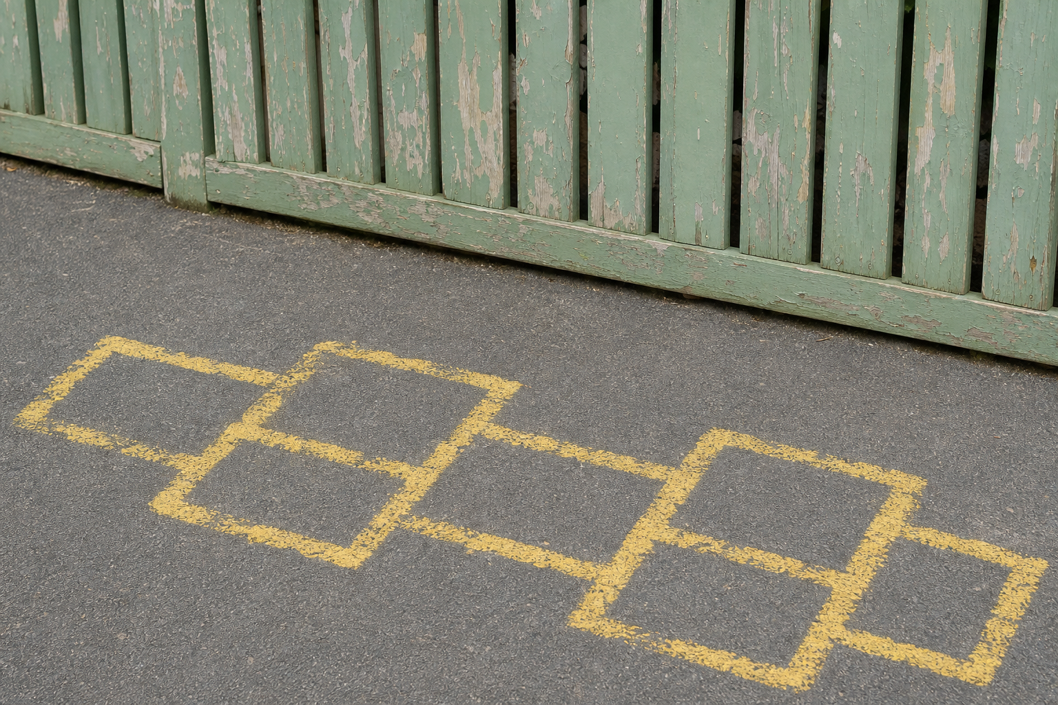 The worn marking and peeling fence paint the lesson opens on